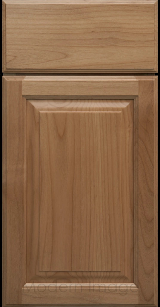 Honey stained Hampton raised panel kitchen cabinets with flat slab drawer fronts.